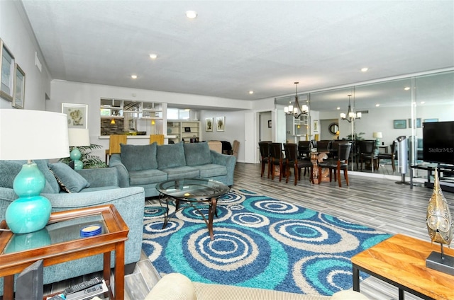 living room featuring a notable chandelier and hardwood / wood-style floors