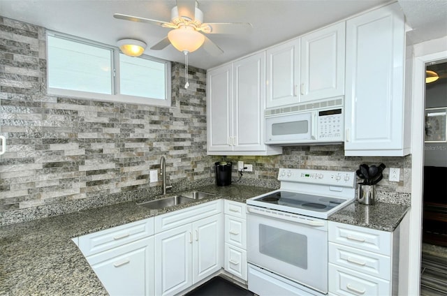 kitchen with sink, tasteful backsplash, white appliances, and white cabinetry