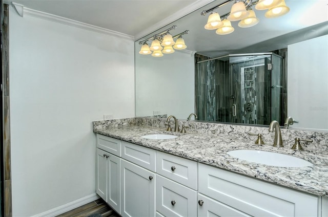 bathroom featuring dual vanity and crown molding