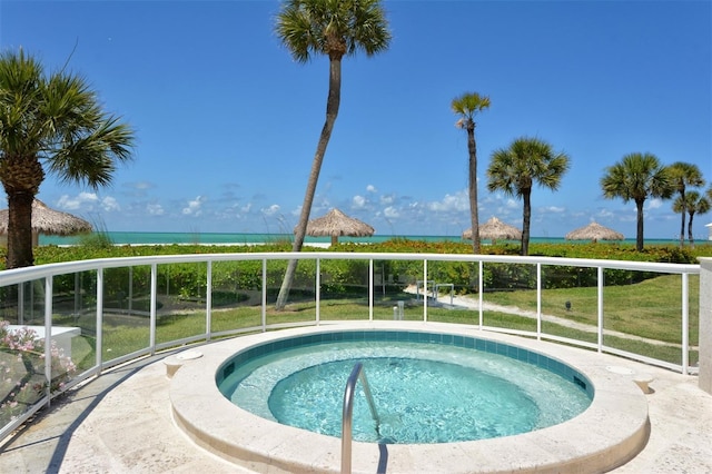 view of swimming pool with an in ground hot tub