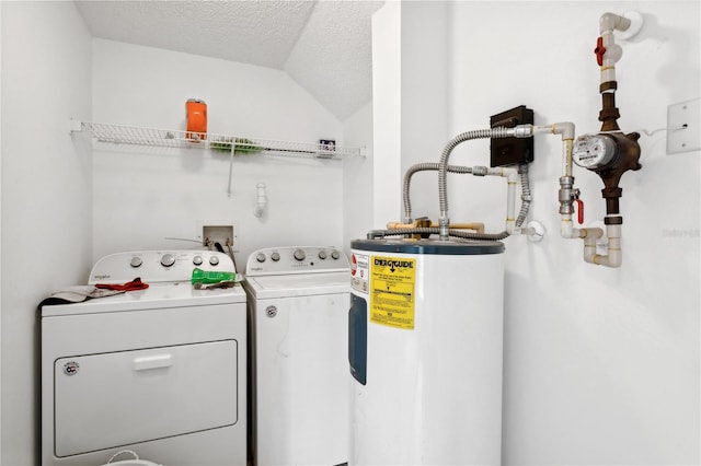 clothes washing area featuring washer hookup, washer and dryer, a textured ceiling, and water heater