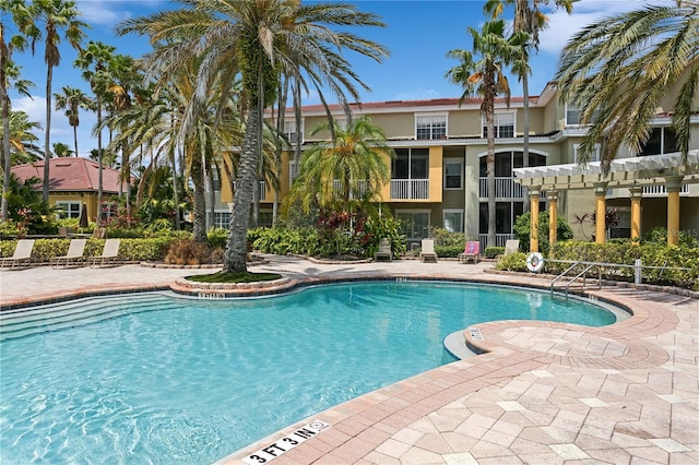 view of swimming pool with a pergola