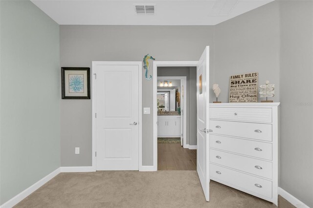 unfurnished bedroom with light carpet