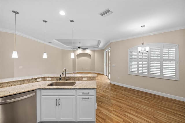 kitchen with dishwasher, white cabinetry, sink, a raised ceiling, and light stone counters