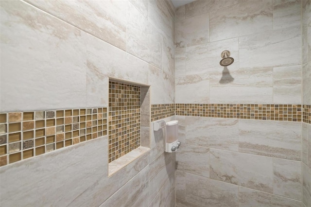 bathroom featuring tiled shower