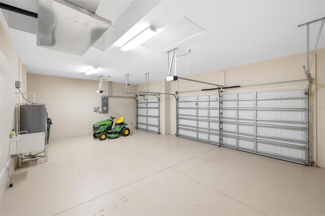 garage featuring electric panel and a garage door opener