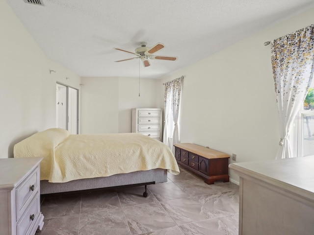 bedroom featuring ceiling fan