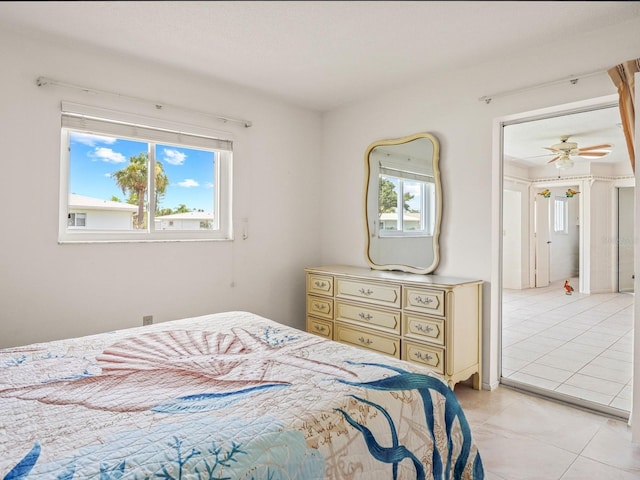 tiled bedroom with multiple windows