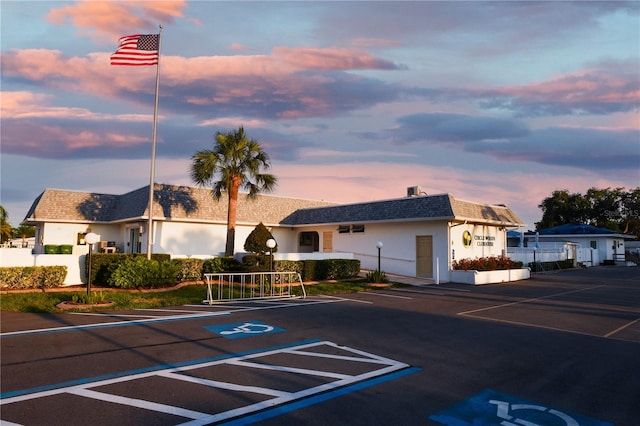 view of outdoor building at dusk