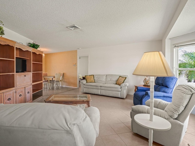 tiled living room with a textured ceiling