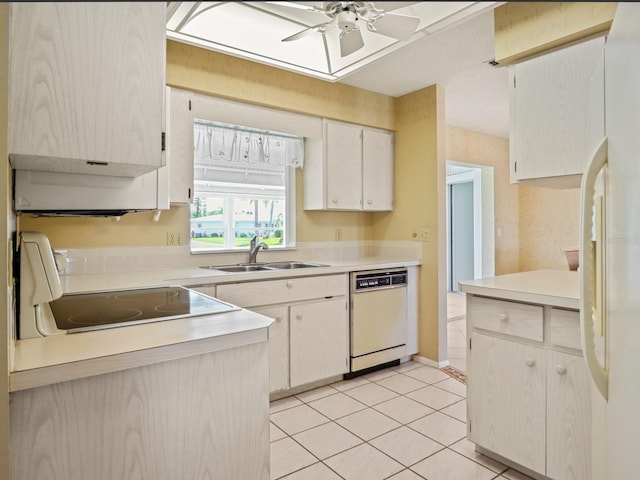 kitchen with sink, white cabinets, light tile patterned floors, ceiling fan, and white appliances