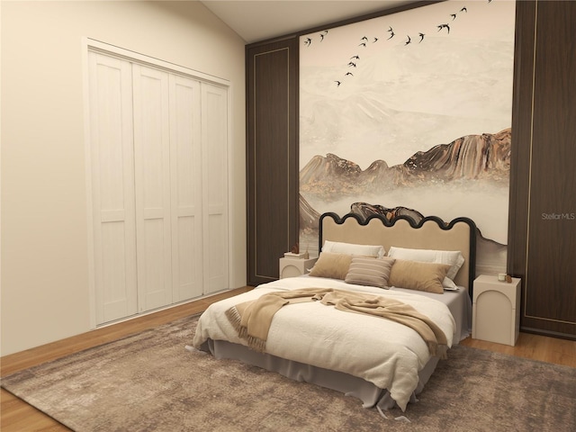 bedroom featuring wood-type flooring and a closet