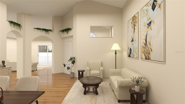 living room featuring high vaulted ceiling and wood-type flooring