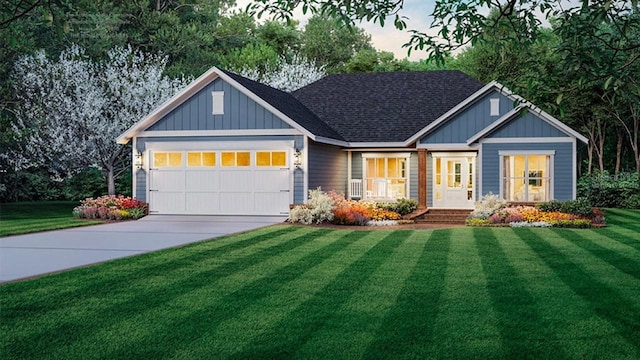 view of front of house featuring a garage and a front lawn