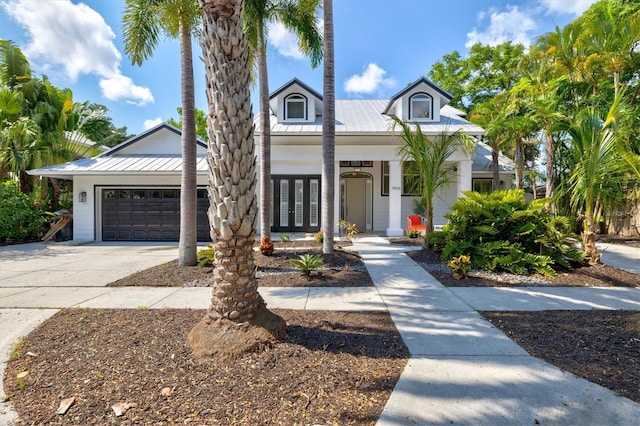 view of front of property with a garage and french doors