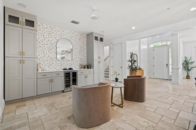 interior space featuring gray cabinets and beverage cooler