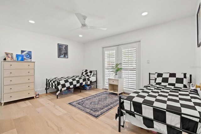 bedroom featuring ceiling fan and light hardwood / wood-style floors