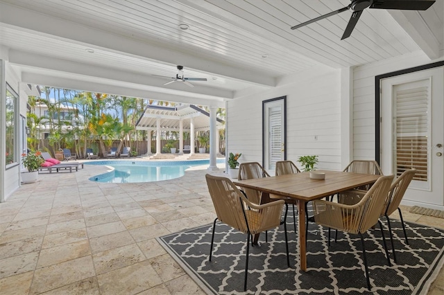 view of swimming pool featuring a patio and ceiling fan