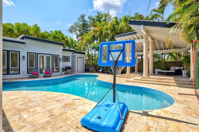 view of pool featuring a patio