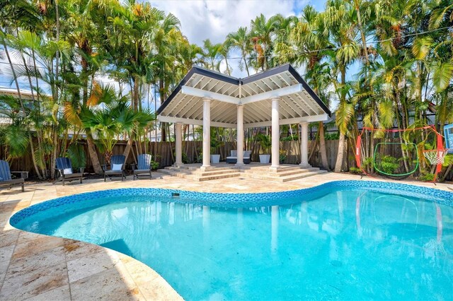 view of swimming pool with a gazebo and a patio area