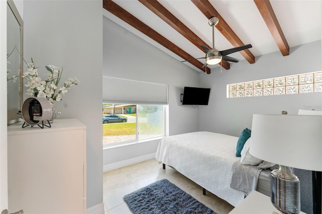 tiled bedroom featuring ceiling fan and lofted ceiling with beams