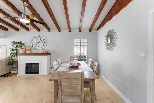 dining room with ceiling fan and beam ceiling