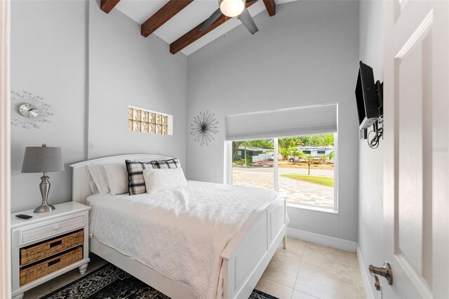 tiled bedroom with ceiling fan, high vaulted ceiling, and beamed ceiling