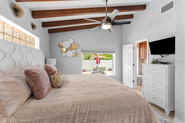 bedroom with ceiling fan and beam ceiling