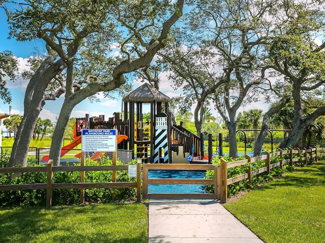 view of playground featuring a lawn