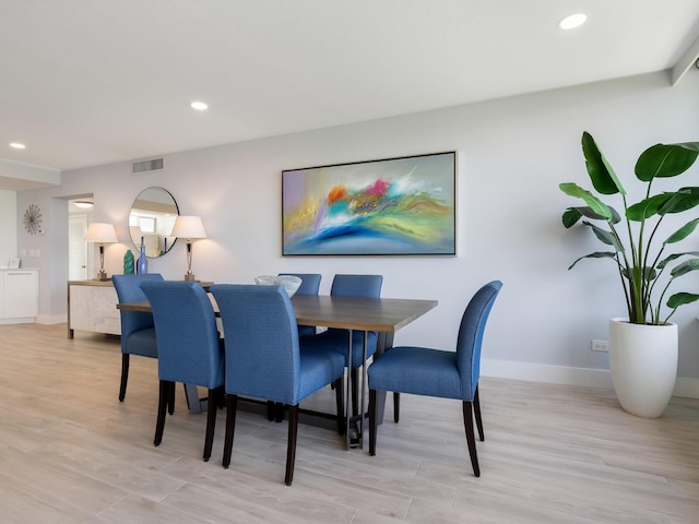 dining area with light hardwood / wood-style flooring