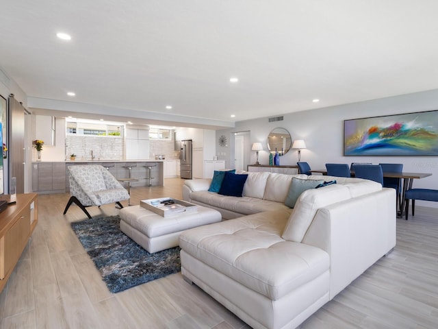 living room with light hardwood / wood-style floors