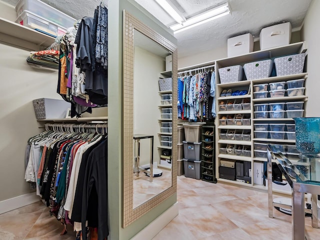 spacious closet featuring tile patterned flooring