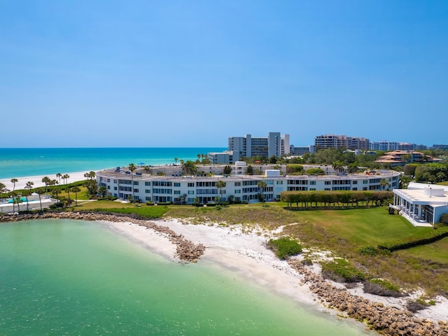 aerial view with a water view and a view of the beach