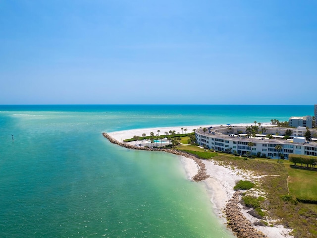 birds eye view of property with a view of the beach and a water view