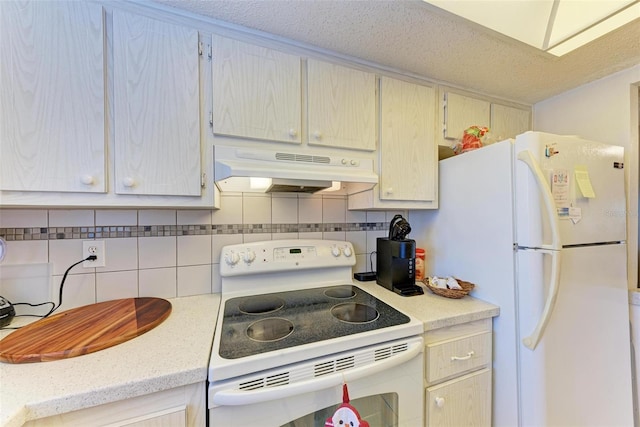 kitchen with white appliances, backsplash, and a textured ceiling