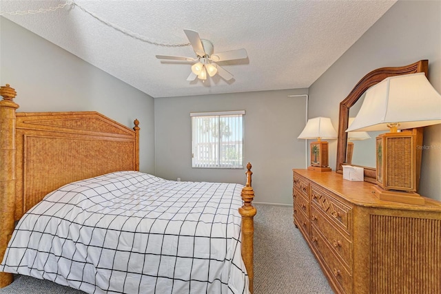 bedroom featuring carpet flooring, ceiling fan, and a textured ceiling