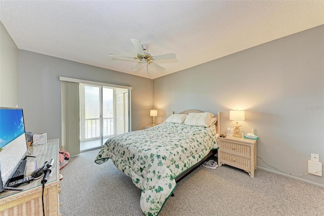 carpeted bedroom with a textured ceiling, ceiling fan, and access to outside