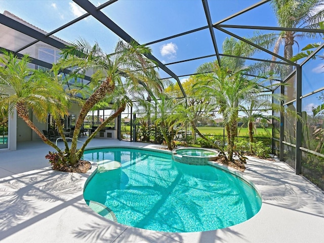 view of swimming pool featuring a patio, glass enclosure, and an in ground hot tub