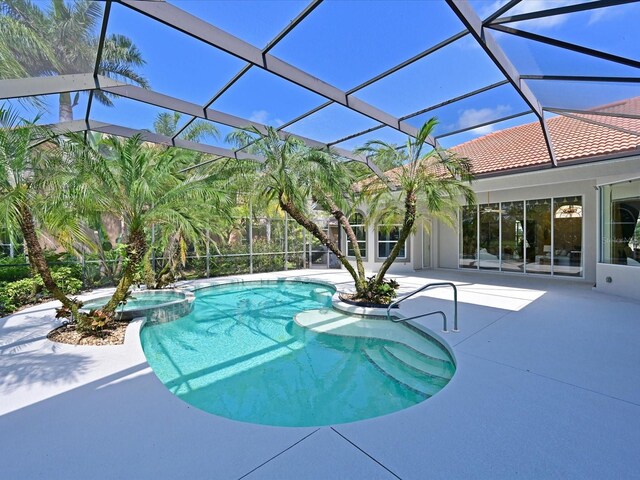 view of pool featuring a lanai and a patio