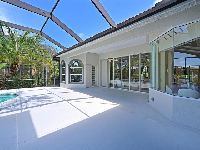 view of patio / terrace featuring glass enclosure