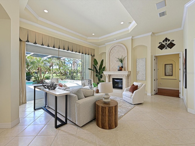 living room featuring a raised ceiling, light tile patterned floors, and crown molding