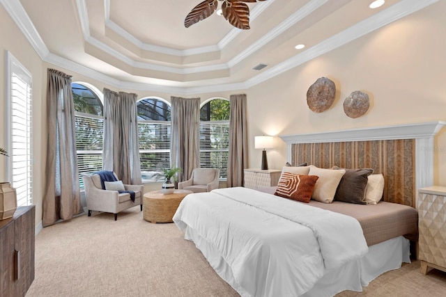 bedroom featuring light colored carpet and multiple windows