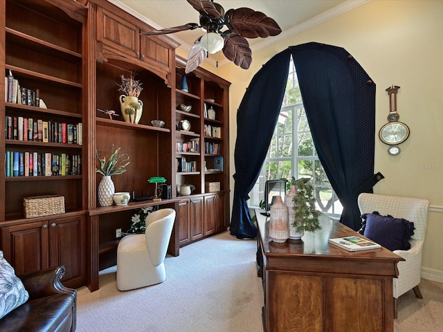 carpeted office with ceiling fan and crown molding