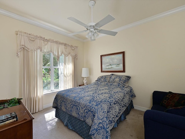 bedroom with crown molding, ceiling fan, and carpet floors