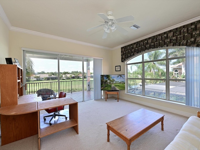 interior space with ceiling fan and crown molding