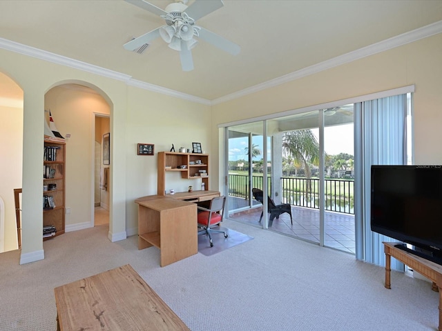 carpeted office space featuring ornamental molding and ceiling fan