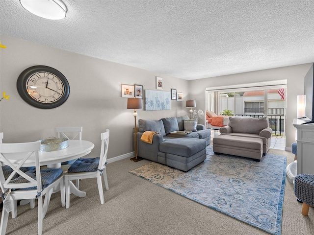 carpeted living room with a textured ceiling