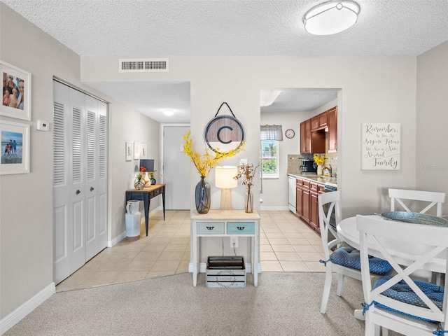 interior space featuring a textured ceiling and sink