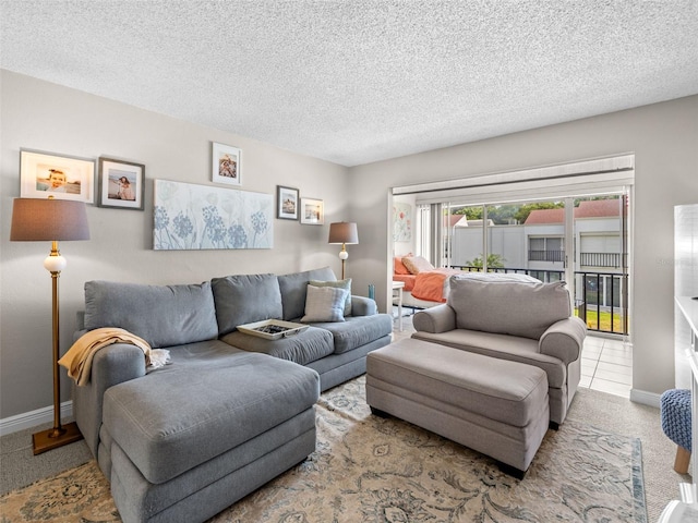 living room featuring tile flooring and a textured ceiling