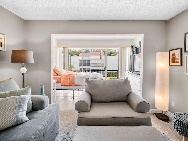 living room with a textured ceiling and carpet flooring